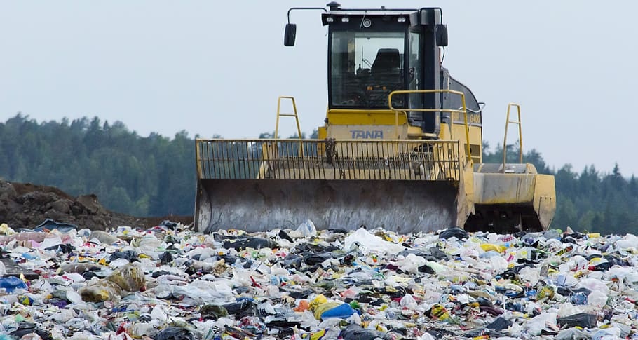 Landfill site with heavy machinery.